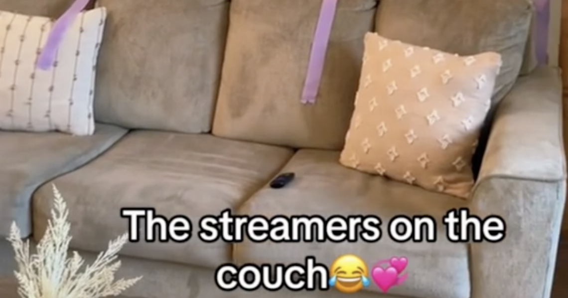 purple streamers draped casually on a couch